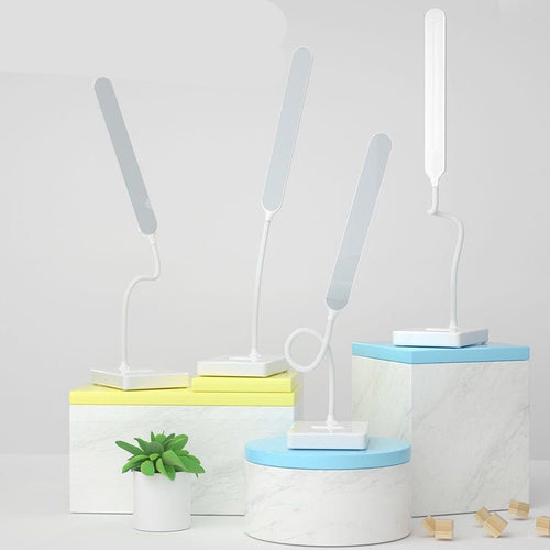 Folding LED desk lamp on a desk