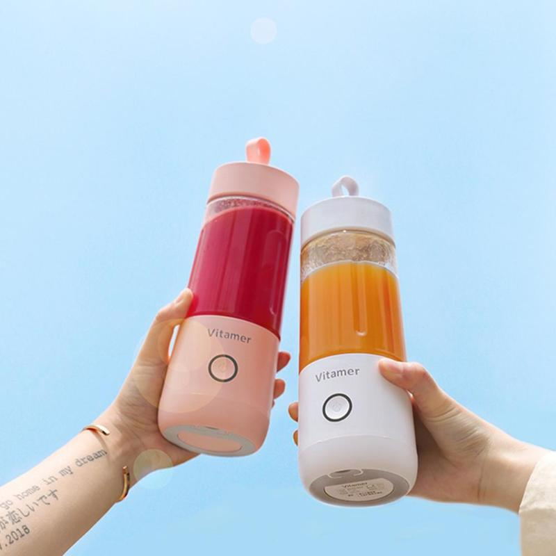 Portable blender making a fresh fruit smoothie